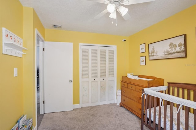 620 Fruitwood Ave, Winter Springs, FL 32708 - carpeted bedroom featuring a closet, ceiling fan, and a textured ceiling