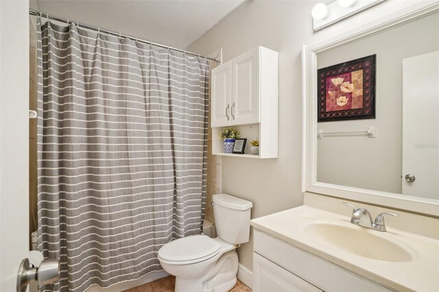 620 Fruitwood Ave, Winter Springs, FL 32708 - bathroom featuring toilet, vanity, shower / tub combo, and tile patterned floors