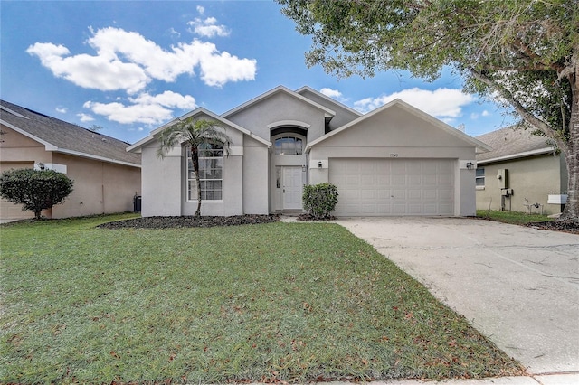 19540 Glen Elm Way, Orlando, FL 32833 - view of front of home featuring an attached garage, a front yard, driveway, and stucco siding