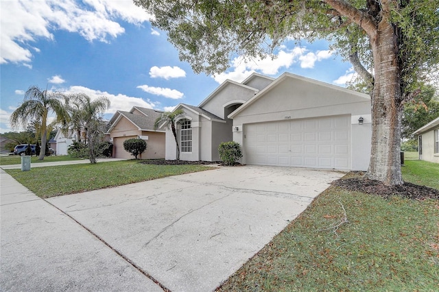 19540 Glen Elm Way, Orlando, FL 32833 - view of front of home with an attached garage, driveway, stucco siding, and a front yard