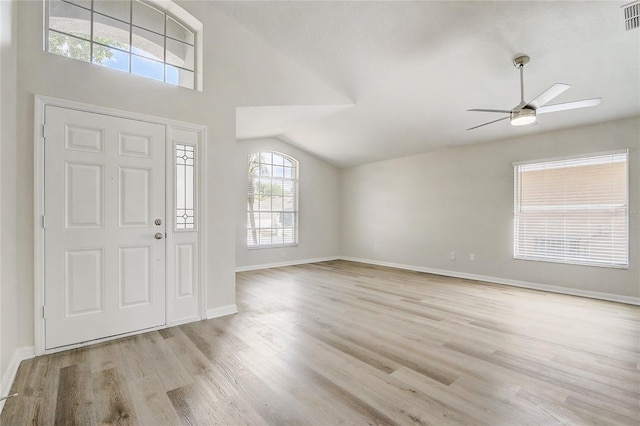19540 Glen Elm Way, Orlando, FL 32833 - foyer entrance with a ceiling fan, light wood finished floors, baseboards, and lofted ceiling