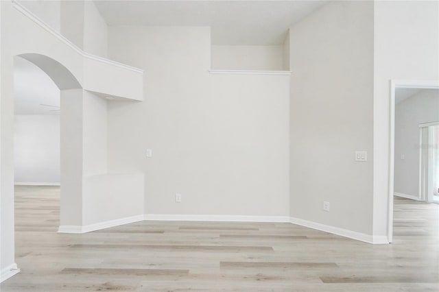19540 Glen Elm Way, Orlando, FL 32833 - unfurnished room featuring arched walkways, light wood finished floors, and baseboards