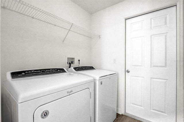19540 Glen Elm Way, Orlando, FL 32833 - washroom with independent washer and dryer and wood finished floors