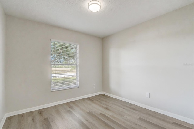 19540 Glen Elm Way, Orlando, FL 32833 - unfurnished room with wood finished floors and baseboards