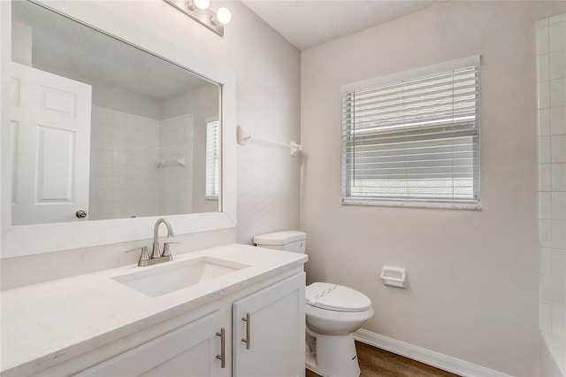 19540 Glen Elm Way, Orlando, FL 32833 - bathroom with a shower, toilet, vanity, and baseboards