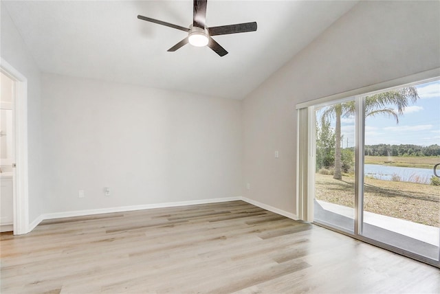 19540 Glen Elm Way, Orlando, FL 32833 - empty room with a ceiling fan, light wood-style flooring, a water view, baseboards, and high vaulted ceiling