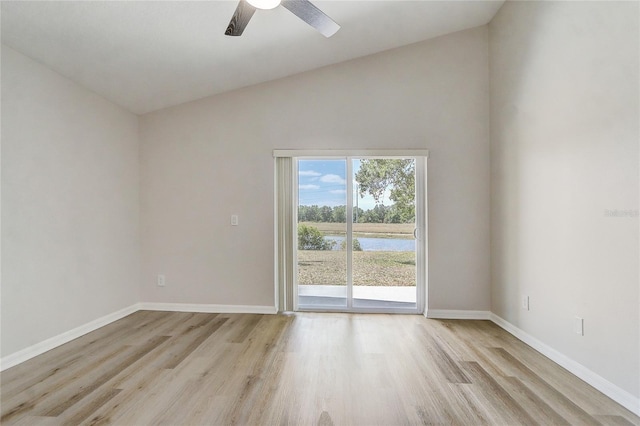 19540 Glen Elm Way, Orlando, FL 32833 - empty room with light wood-style floors, a water view, baseboards, a ceiling fan, and high vaulted ceiling