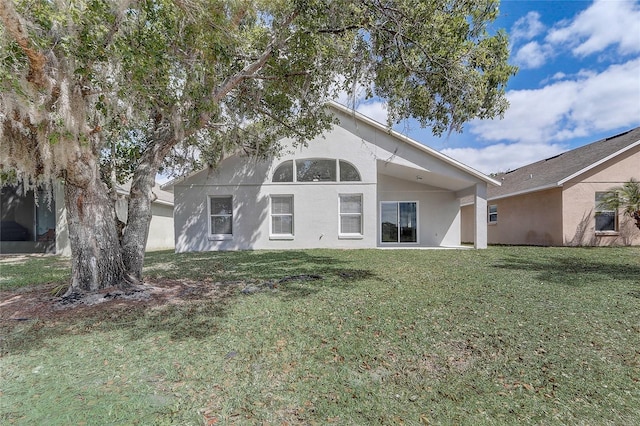 19540 Glen Elm Way, Orlando, FL 32833 - rear view of house featuring a lawn and stucco siding