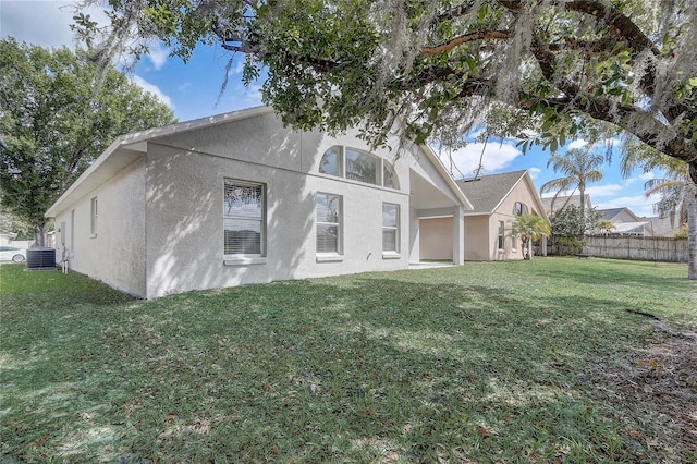 19540 Glen Elm Way, Orlando, FL 32833 - back of property with stucco siding and central air condition unit