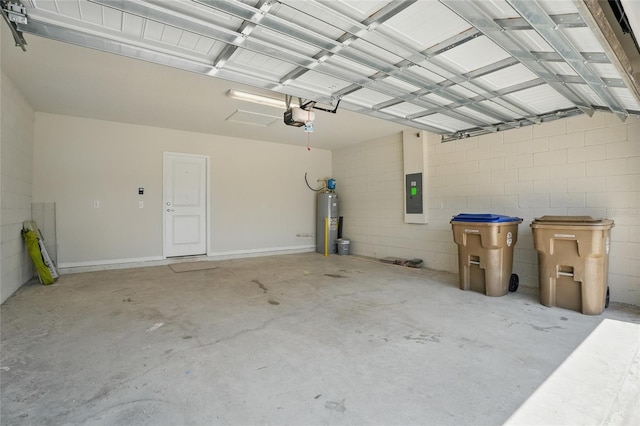 garage with electric water heater, electric panel, a garage door opener, and concrete block wall