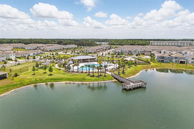 drone / aerial view of a large body of water and a pool