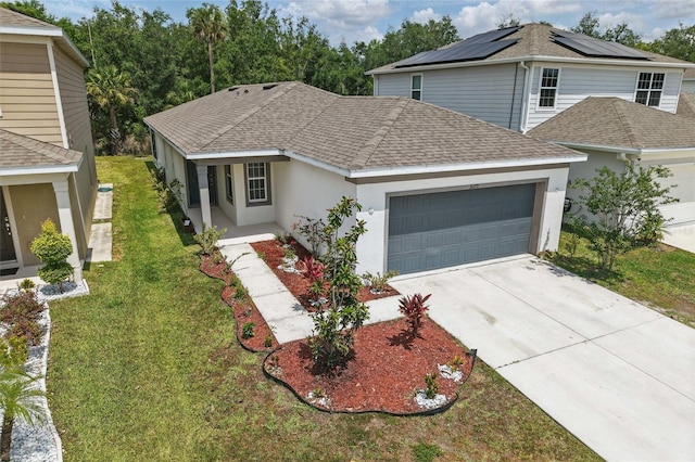 traditional home with roof with shingles, an attached garage, stucco siding, and a front yard