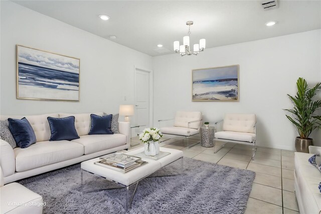 living area featuring a chandelier, light tile patterned floors, and recessed lighting