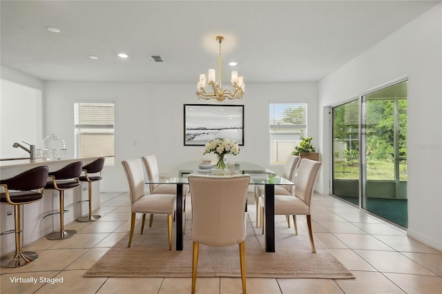dining area featuring a chandelier, recessed lighting, and light tile patterned flooring