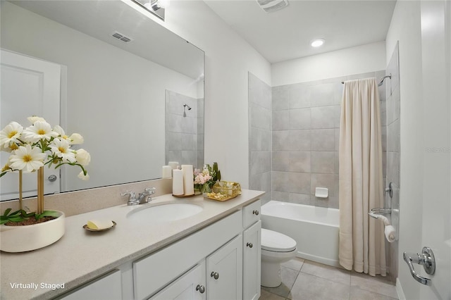 bathroom with toilet, tile patterned flooring, shower / tub combo with curtain, and vanity