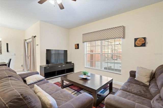 8941 Bismarck Palm Rd, Kissimmee, FL 34747 - living area with ceiling fan and baseboards