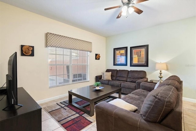 8941 Bismarck Palm Rd, Kissimmee, FL 34747 - living area with ceiling fan, light tile patterned flooring, and baseboards