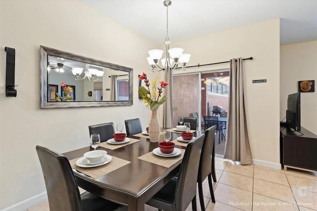 8941 Bismarck Palm Rd, Kissimmee, FL 34747 - dining space featuring a chandelier, baseboards, and light tile patterned floors