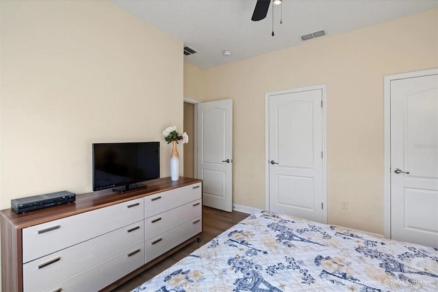 8941 Bismarck Palm Rd, Kissimmee, FL 34747 - bedroom featuring dark wood-style floors, ceiling fan, and baseboards