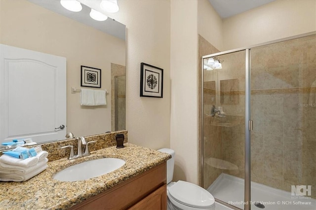 8941 Bismarck Palm Rd, Kissimmee, FL 34747 - bathroom with a stall shower, toilet, and vanity