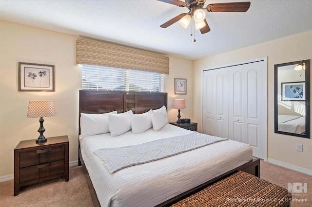 8941 Bismarck Palm Rd, Kissimmee, FL 34747 - bedroom featuring light carpet, a closet, baseboards, and ceiling fan
