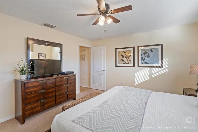 8941 Bismarck Palm Rd, Kissimmee, FL 34747 - bedroom with light colored carpet, baseboards, and ceiling fan