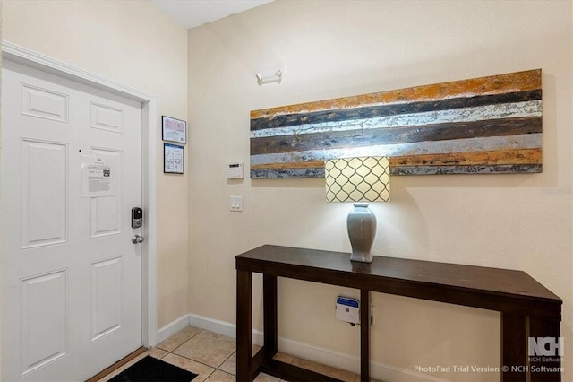8941 Bismarck Palm Rd, Kissimmee, FL 34747 - foyer with light tile patterned floors and baseboards