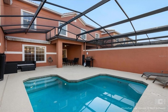 8941 Bismarck Palm Rd, Kissimmee, FL 34747 - swimming pool with a patio area, an outdoor living space, a grill, and glass enclosure