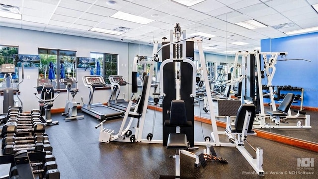 8941 Bismarck Palm Rd, Kissimmee, FL 34747 - gym with a paneled ceiling and baseboards