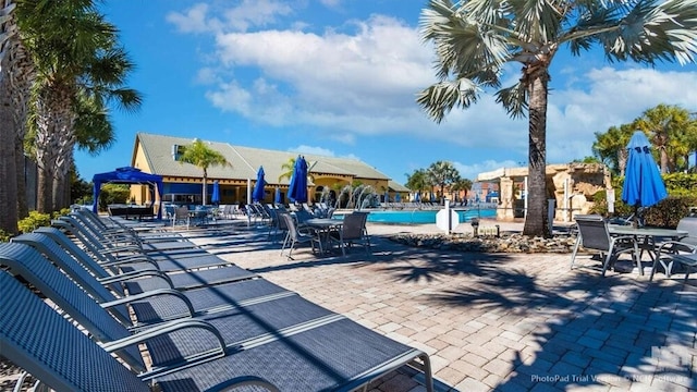 8941 Bismarck Palm Rd, Kissimmee, FL 34747 - community pool featuring a patio area