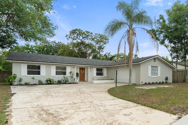 3520 Balsam Dr, Winter Park, FL 32792 - ranch-style house with concrete driveway, fence, an attached garage, and a shingled roof