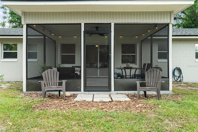 3520 Balsam Dr, Winter Park, FL 32792 - rear view of property featuring concrete block siding, a sunroom, and roof with shingles