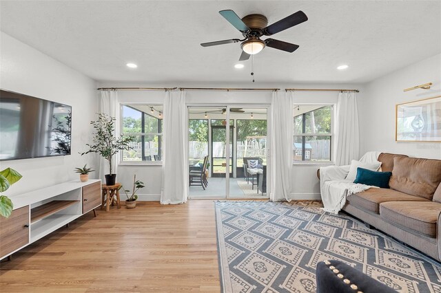 3520 Balsam Dr, Winter Park, FL 32792 - living room with baseboards, ceiling fan, light wood-type flooring, plenty of natural light, and recessed lighting