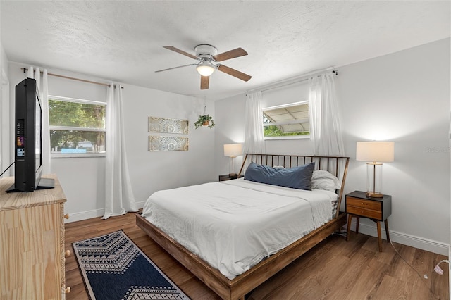3520 Balsam Dr, Winter Park, FL 32792 - bedroom with baseboards, wood finished floors, a textured ceiling, and ceiling fan