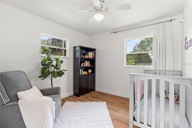 3520 Balsam Dr, Winter Park, FL 32792 - bedroom with multiple windows, wood finished floors, and baseboards