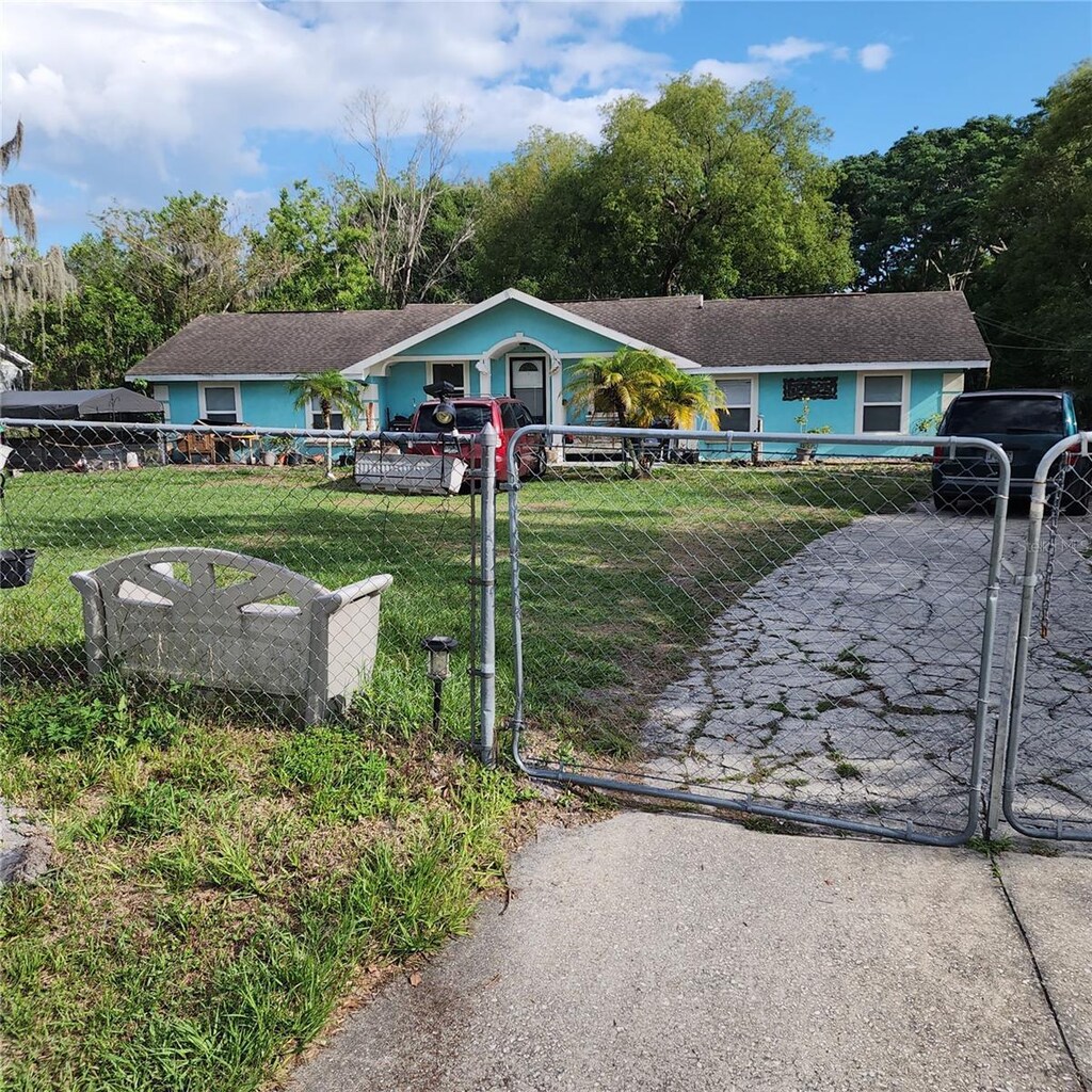 single story home with a gate
