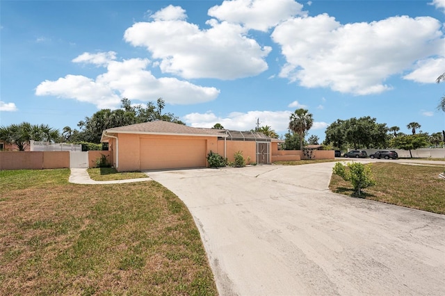 1301 Lucaya Ave, Venice, FL 34285 - view of front of house featuring driveway, an attached garage, and stucco siding