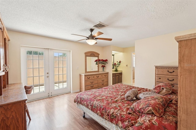 1301 Lucaya Ave, Venice, FL 34285 - bedroom featuring access to outside, french doors, wood finished floors, a textured ceiling, and ceiling fan