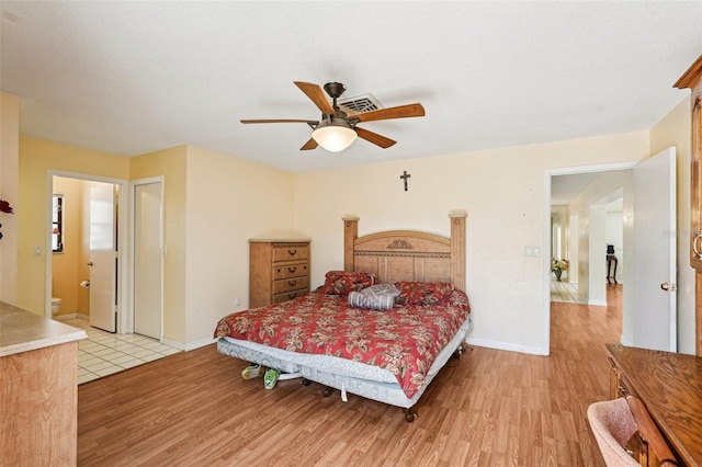 1301 Lucaya Ave, Venice, FL 34285 - bedroom with light wood finished floors, baseboards, and ceiling fan