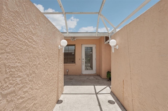 1301 Lucaya Ave, Venice, FL 34285 - view of exterior entry with a patio and stucco siding