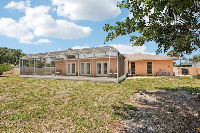 1301 Lucaya Ave, Venice, FL 34285 - back of property featuring french doors, a patio, and stucco siding