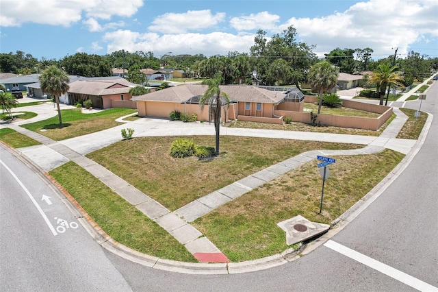 1301 Lucaya Ave, Venice, FL 34285 - view of front of home with driveway, a residential view, a front yard, and an attached garage