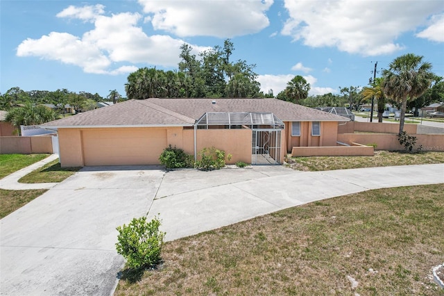 1301 Lucaya Ave, Venice, FL 34285 - ranch-style home featuring a garage, driveway, and stucco siding