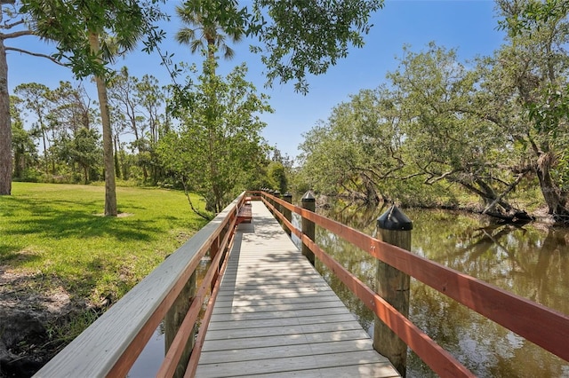 1301 Lucaya Ave, Venice, FL 34285 - dock area with a yard and a water view