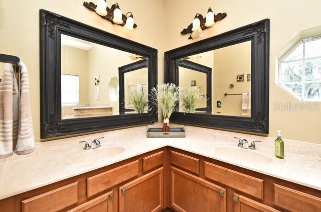 full bath featuring double vanity