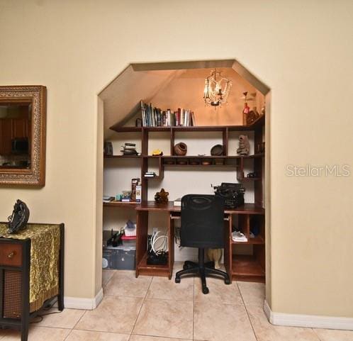 home office with tile patterned flooring and baseboards