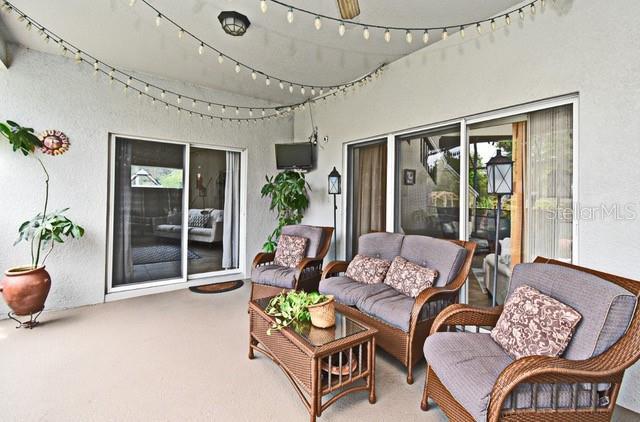 sunroom / solarium featuring an outdoor hangout area