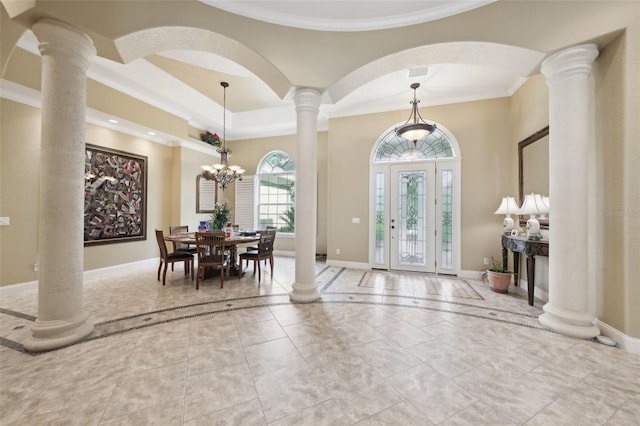 6686 SE 135th St, Summerfield, FL 34491 - foyer featuring decorative columns, crown molding, baseboards, and a raised ceiling