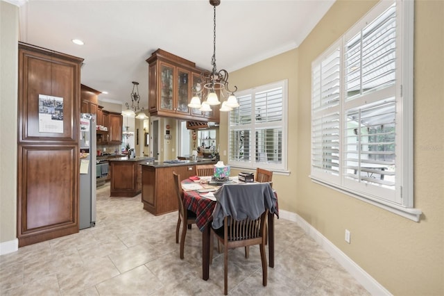 6686 SE 135th St, Summerfield, FL 34491 - dining room featuring a chandelier, crown molding, light tile patterned floors, baseboards, and recessed lighting