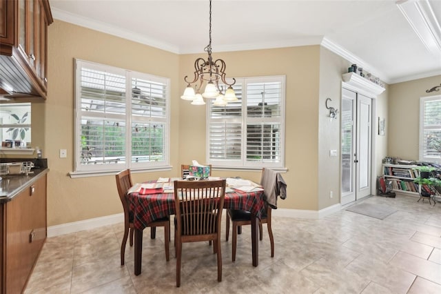 6686 SE 135th St, Summerfield, FL 34491 - dining space with a chandelier, crown molding, baseboards, and light tile patterned flooring